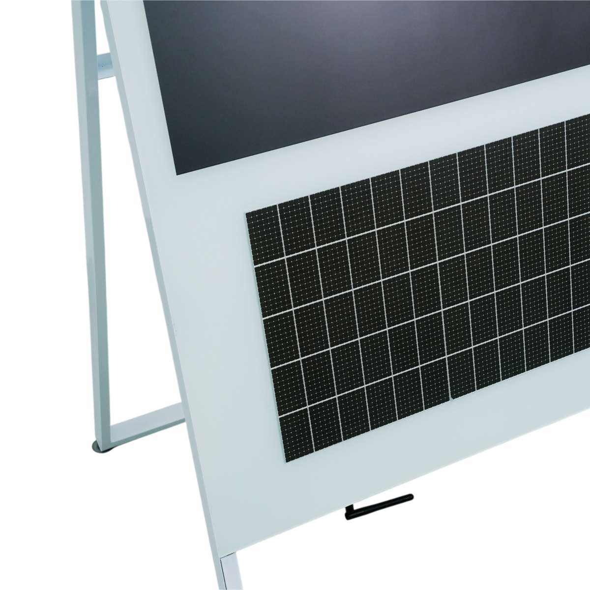 Close-up of the kiosk's lower front: display bezel edge and integrated solar panel